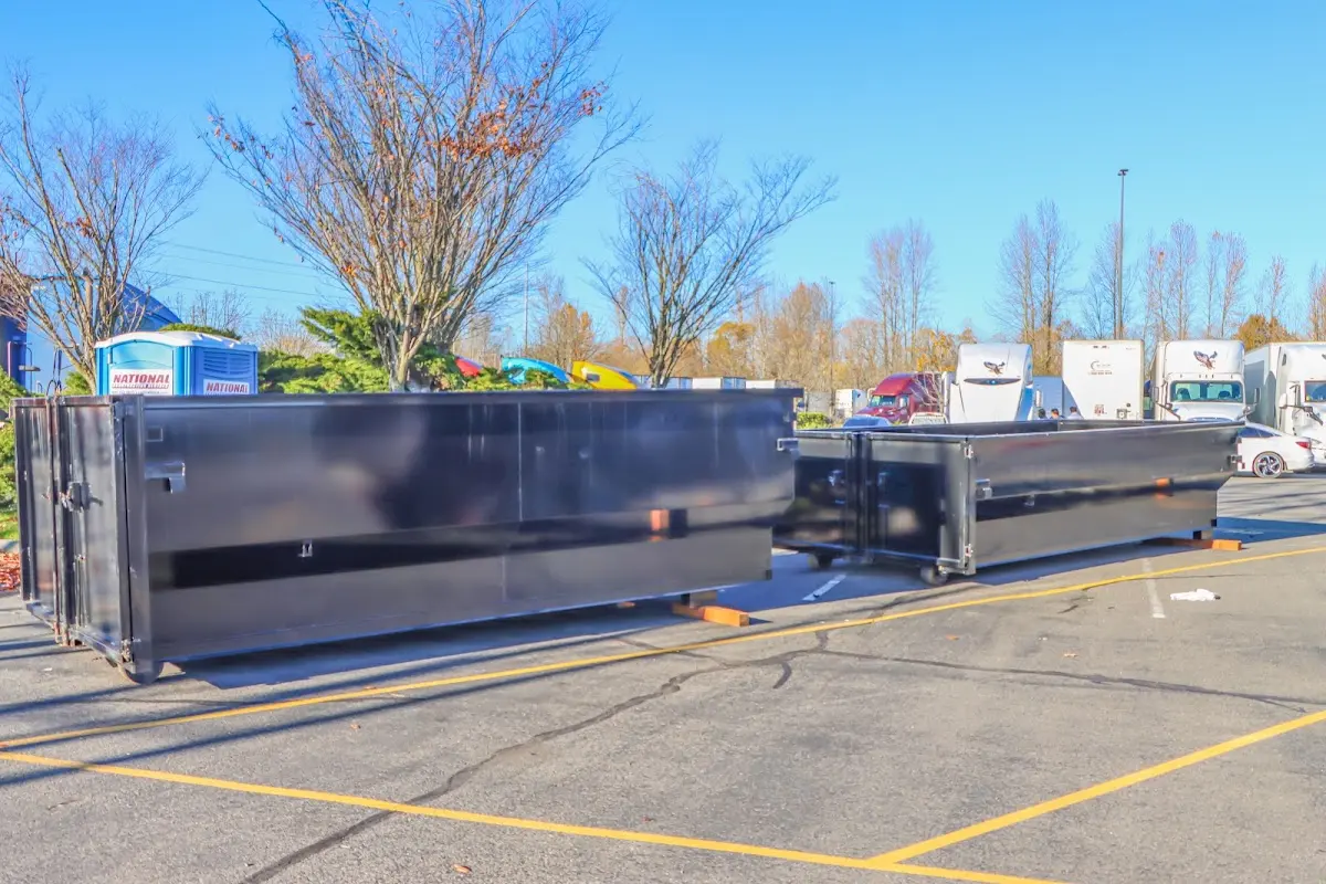 Professional dumpster rental service with roll-off container on residential driveway in Willoughby Hills